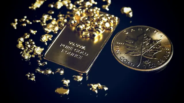 Los precios del oro aumentan a medida que el dólar se debilita ante menores expectativas de aumento de tasas de la Fed